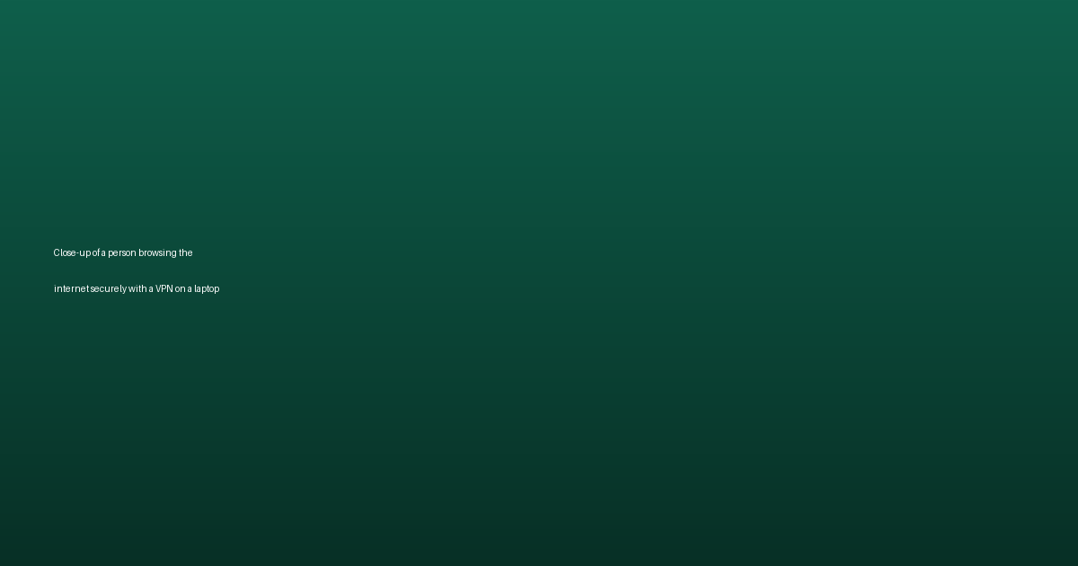 Close-up of a person browsing the internet securely with a VPN on a laptop